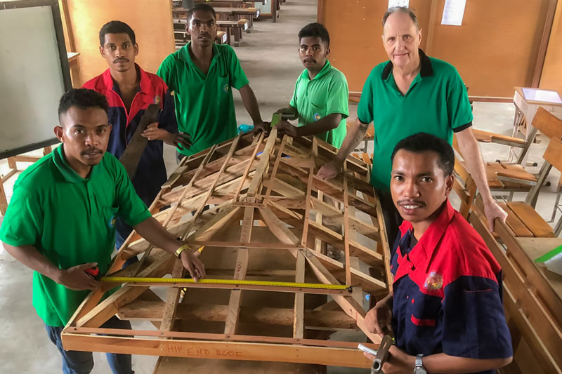 Volunteer Jim with woodwork students